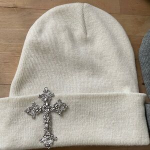 Elegant Cream Beanie with Silver Cross